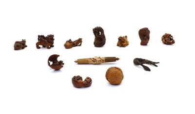 Lot 68 - A collection of Asian carved wooden and simulated wooden mythological creatures and similar