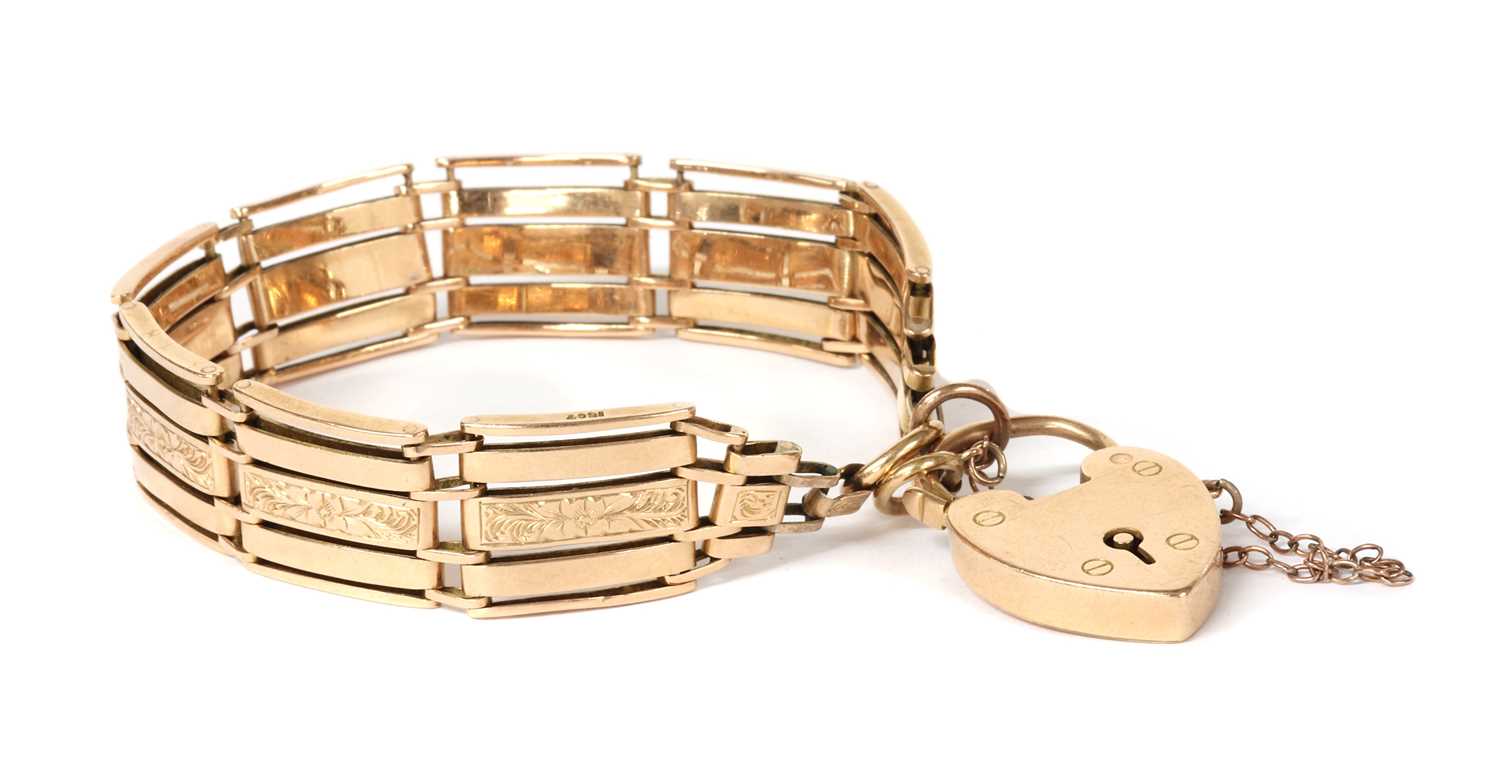 Lot 1110 - A gold five row gate bracelet