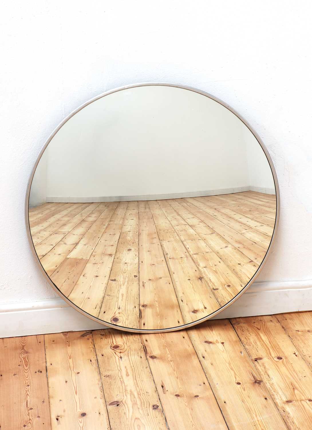 Lot 596 - A convex wall mirror