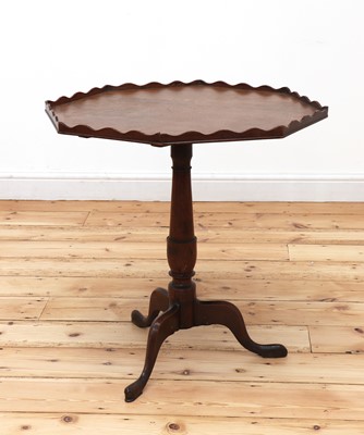 Lot 541 - An oak octagonal tripod table