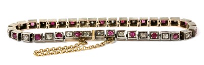 Lot 7 - A French silver and gold, ruby and diamond line bracelet