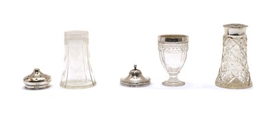 Lot 8 - Three various glass and silver topped casters