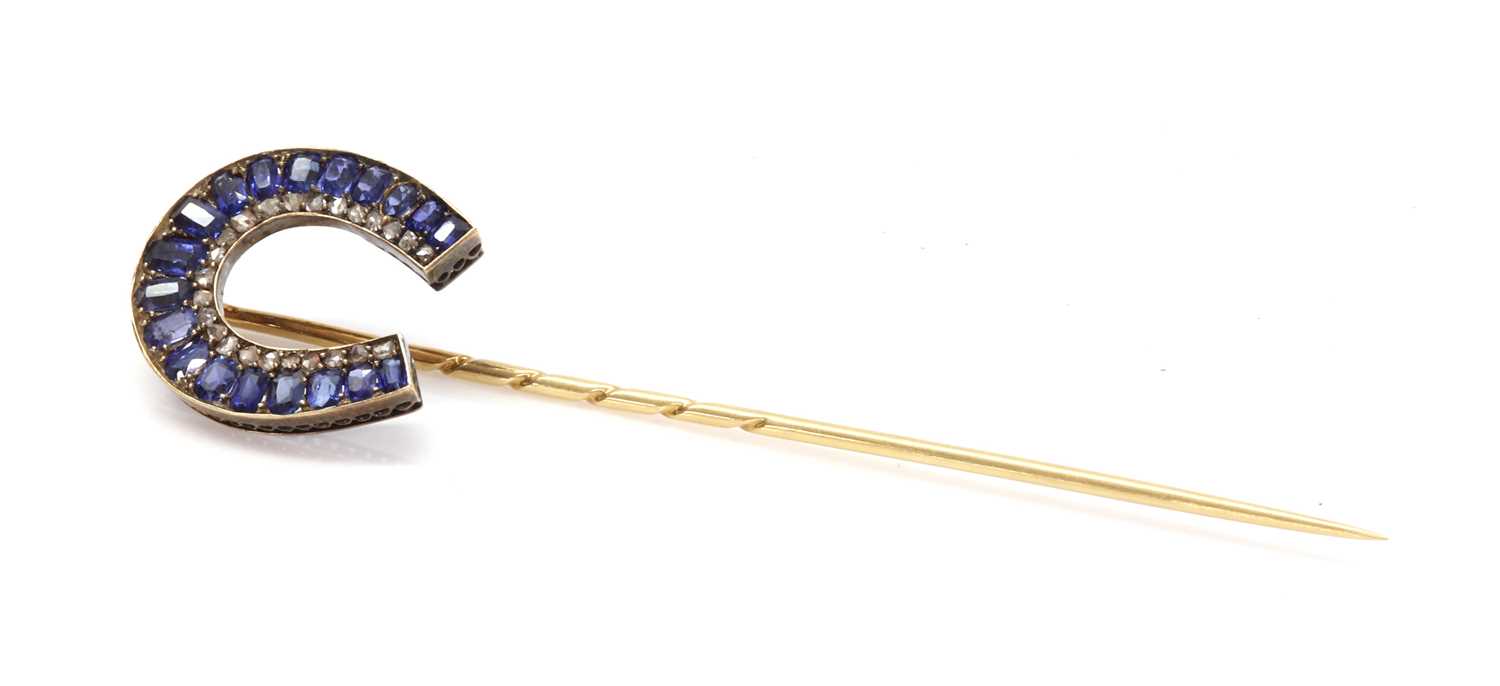 Lot 52 - A former Austro-Hungarian sapphire and diamond horseshoe stick pin, attributed to Moritz Henolé