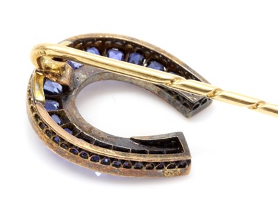 Lot 52 - A former Austro-Hungarian sapphire and diamond horseshoe stick pin, attributed to Moritz Henolé