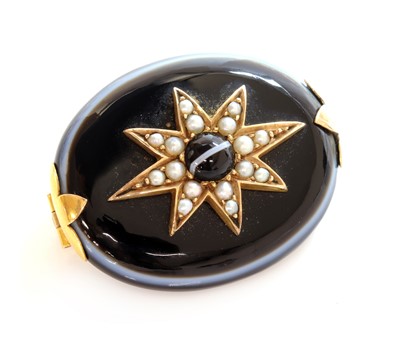 Lot 95 - A Victorian bullseye agate and split pearl star brooch