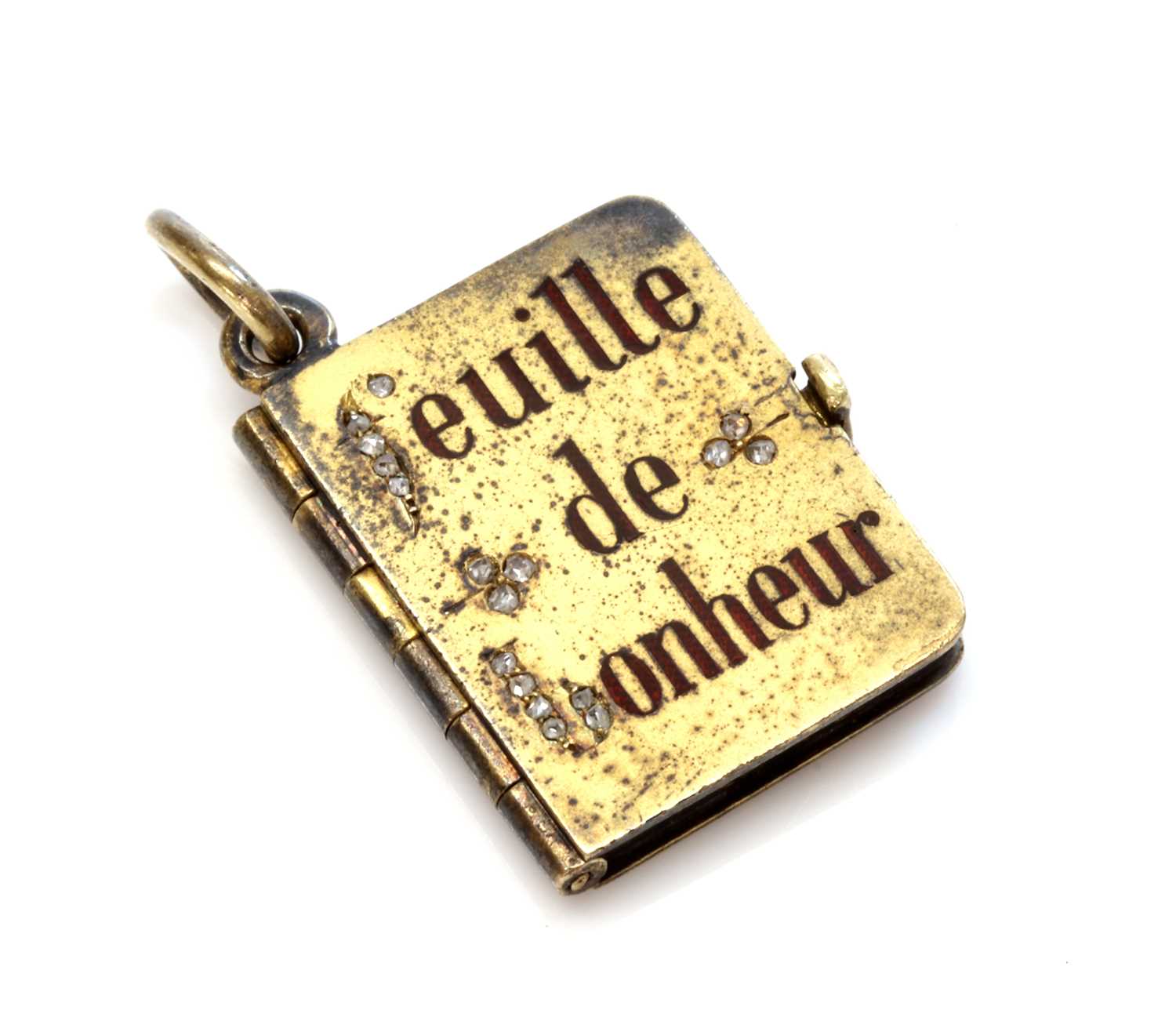 Lot 67 - An Austrian gold diamond and enamel set book form locket, c.1900