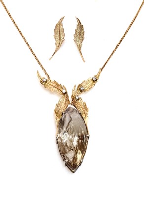 Lot 254 - An 18ct two colour gold smoky quartz and diamond necklace and earring suite, c.1990