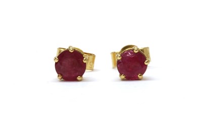 Lot 1220 - A pair of 18ct gold single stone ruby stud earrings