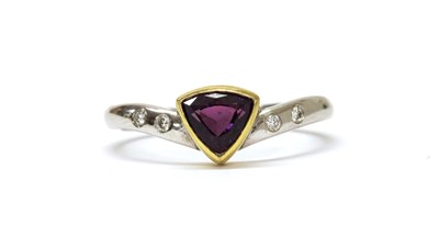 Lot 1247 - An 18ct gold purple sapphire and diamond ring