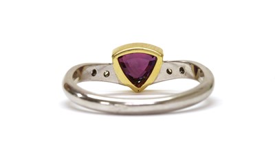 Lot 1247 - An 18ct gold purple sapphire and diamond ring