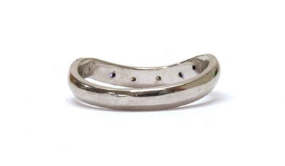 Lot 1208 - An 18ct white gold diamond set shaped band ring
