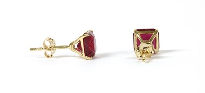 Lot 109 - A pair of gold single stone fracture filled ruby stud earrings