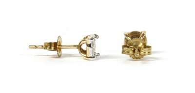 Lot 46 - A pair of gold single stone diamond stud earrings