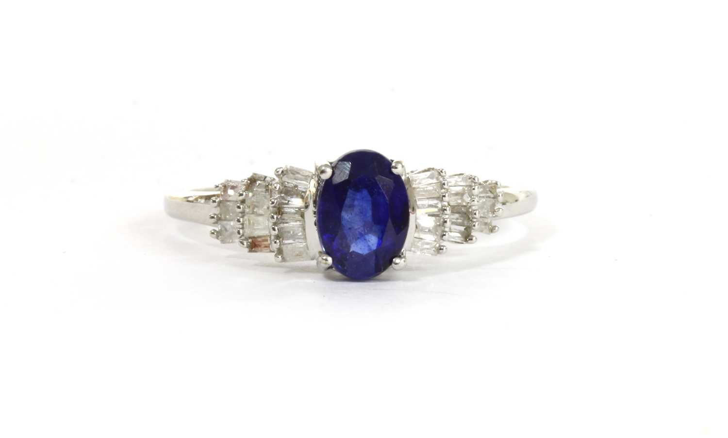 Lot 127 - A white gold sapphire and diamond ring