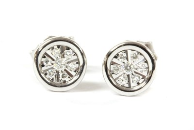Lot 68 - A pair of white gold diamond earrings