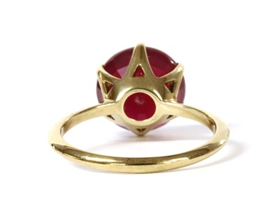 Lot 106 - A gold single stone fracture filled ruby ring