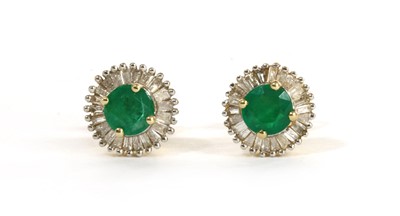 Lot 141 - A pair of gold emerald and diamond cluster stud earrings