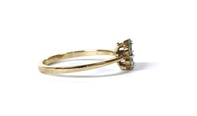 Lot 56 - A gold diamond daisy cluster ring
