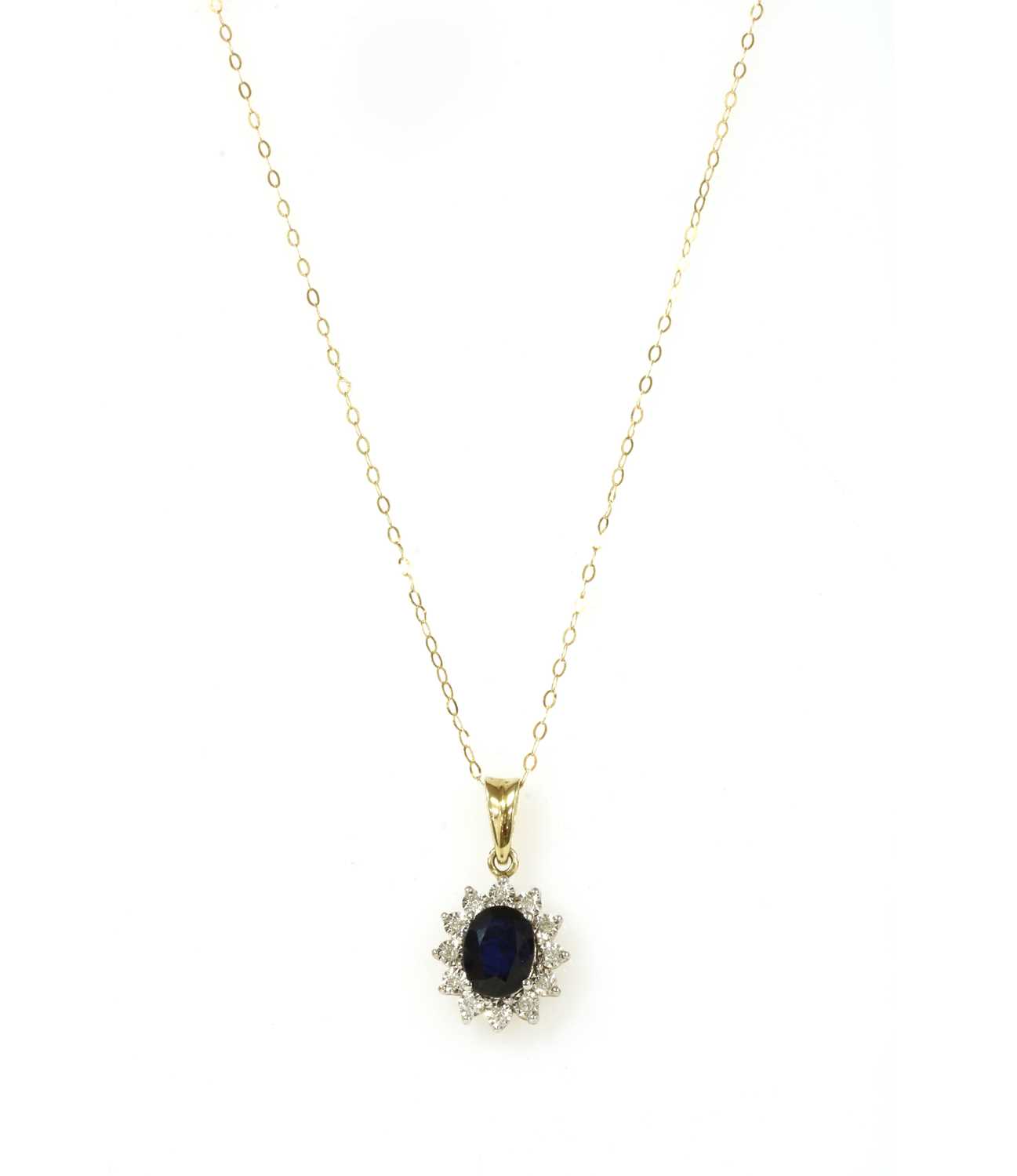 Lot 123 - A gold sapphire and diamond cluster pendant