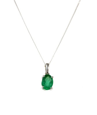 Lot 138 - A white gold single stone emerald pendant