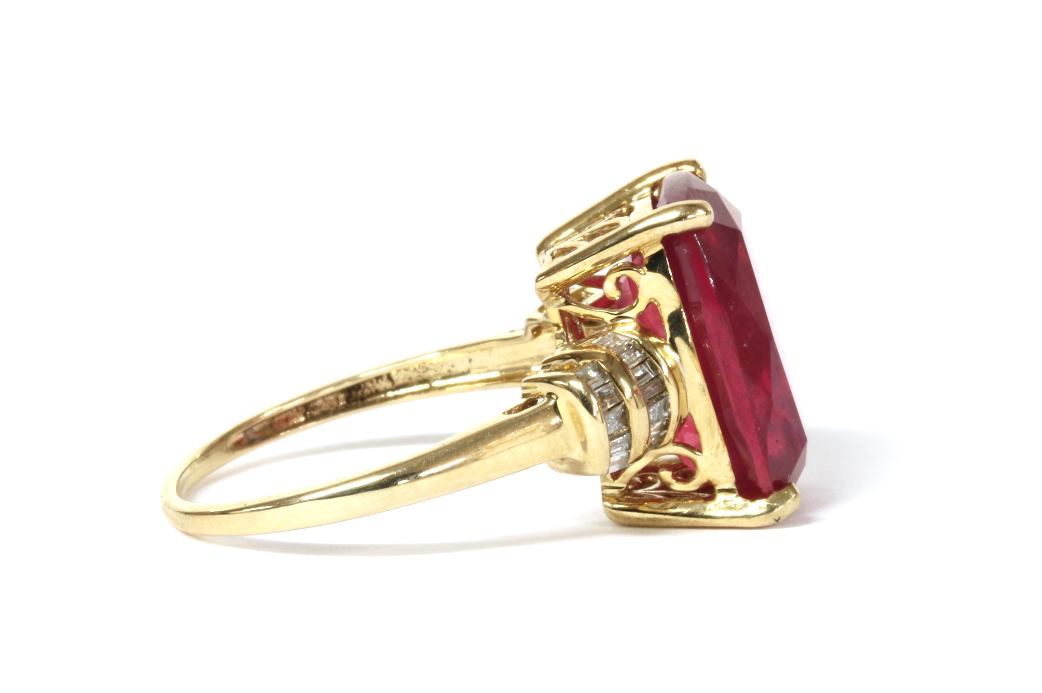 Lot 110 - A gold fracture filled ruby and diamond ring,