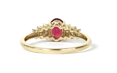 Lot 111 - A gold fracture filled ruby and diamond ring
