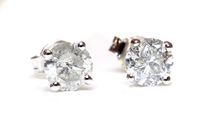 Lot 436 - A pair of white gold single stone diamond earrings