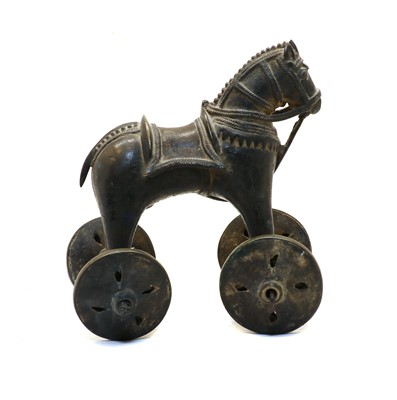 Lot 105 - An early 20th century Indian brass wheeled model horse