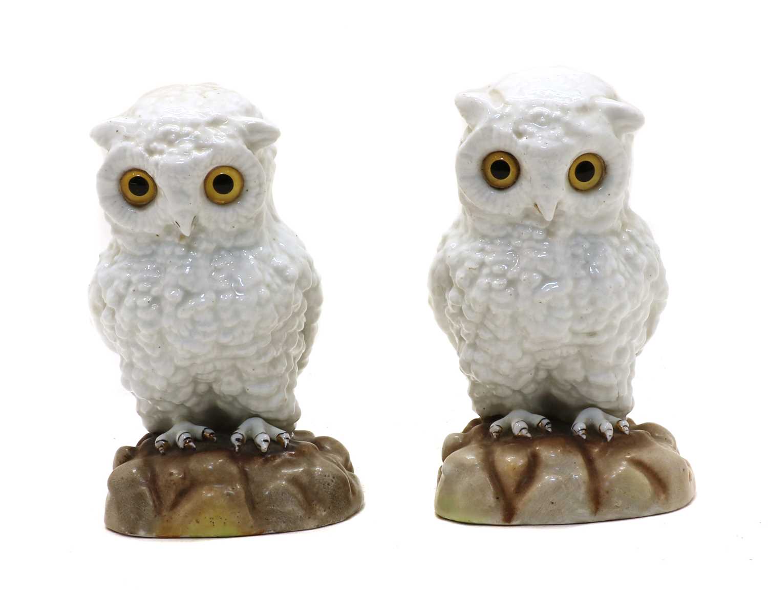 Lot 101 - A pair of continental white porcelain owls