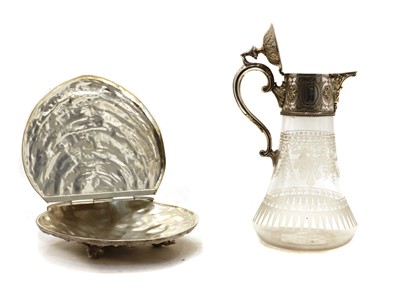 Lot 57 - A silver plated and glass claret jug and a shell box