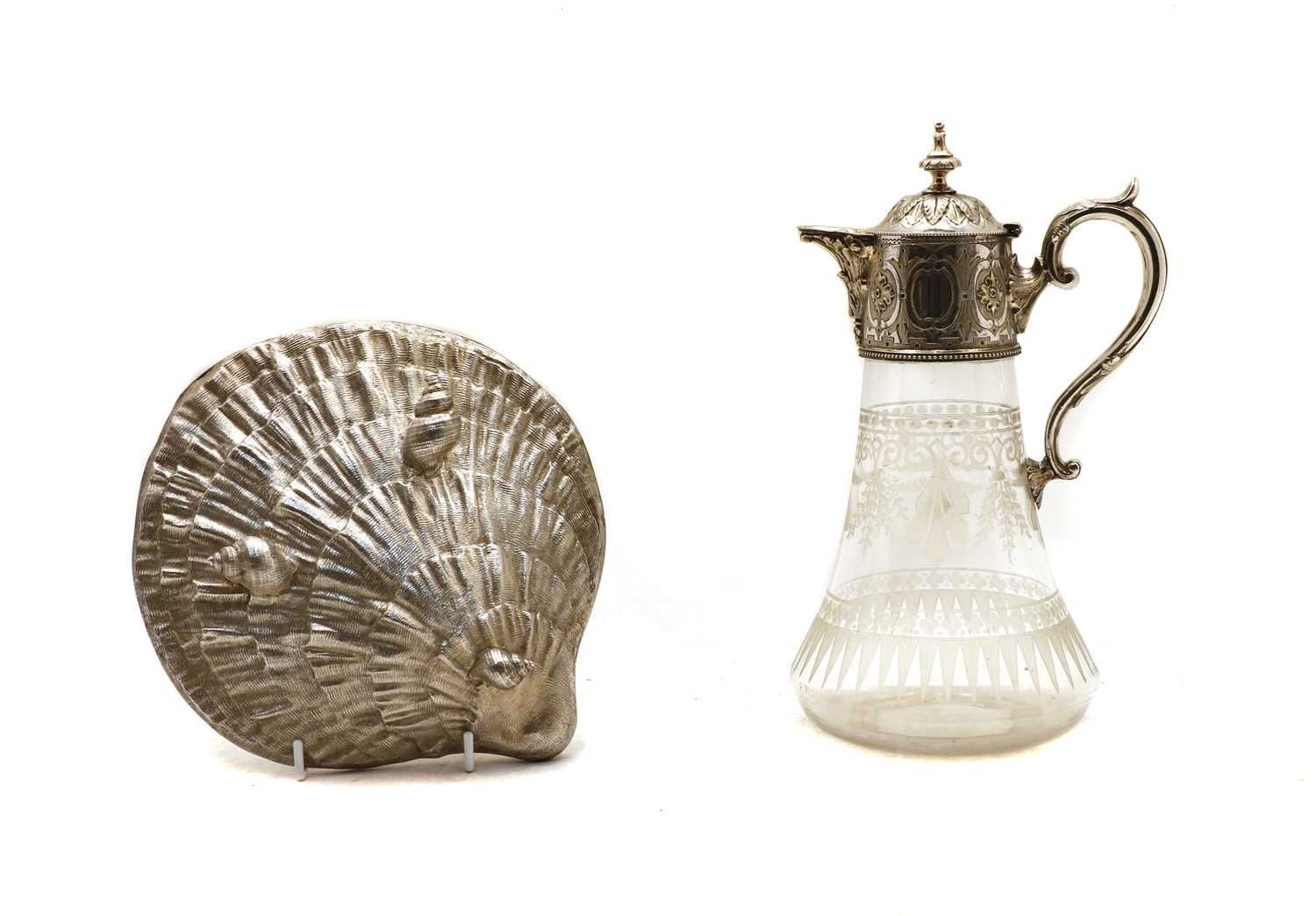 Lot 57 - A silver plated and glass claret jug and a shell box