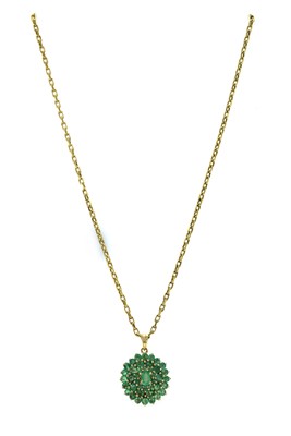 Lot 1267 - A 9ct gold emerald cluster pendant