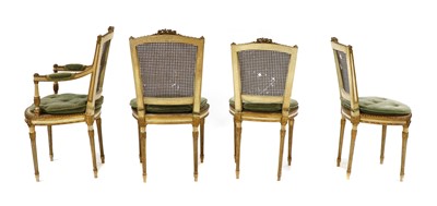 Lot 202 - A set of four Louis XVI style painted elbow and giltwood chairs