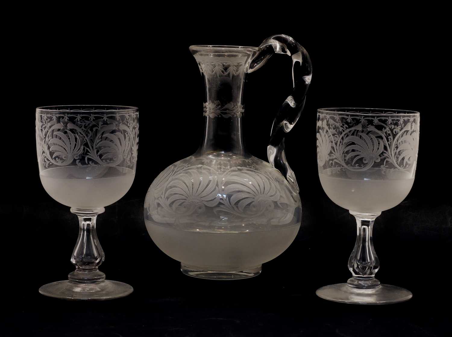 Lot 100 - An etched glass carafe and two glasses
