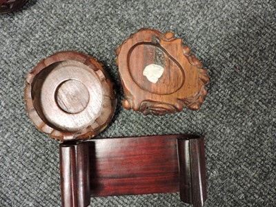 Lot 117 - A collection of Chinese wood stands