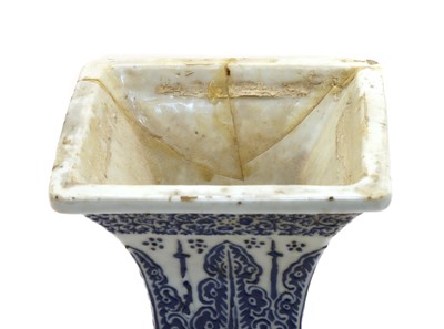 Lot 185 - A Chinese square of baluster shaped white vase with raised blue decoration