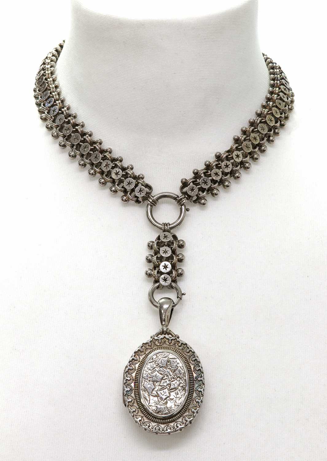 Lot 77 - A late Victorian sterling silver locket and collar, c.1880