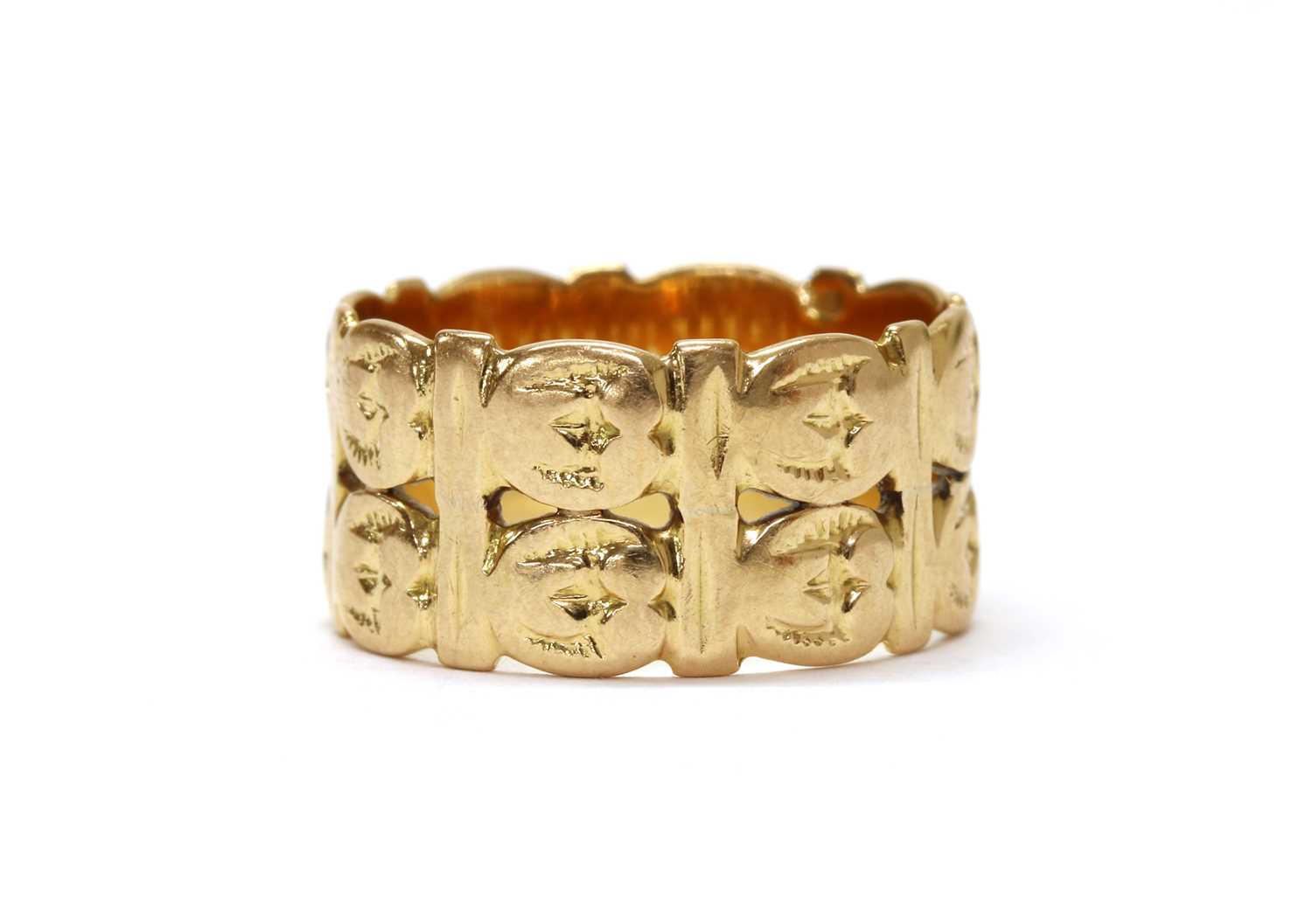 Lot 1082 - A gold two row pierced band ring