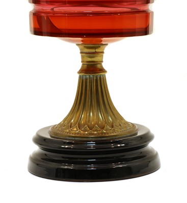 Lot 263 - A Victorian cranberry glass oil lamp