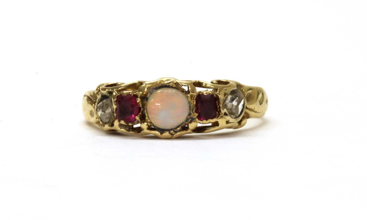 Lot 1014 - A gold opal, ruby and diamond ring