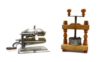 Lot 52 - An American 'Crown' pasta maker and a French wooden press