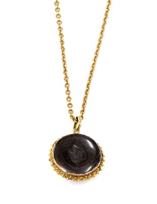 Lot 22 - A Regency gold circular gem set pendant, c.1820