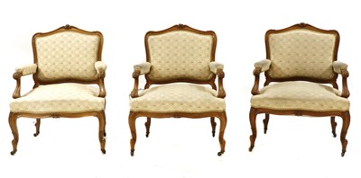 Lot 199 - A series of three Austrian walnut framed upholstered armchairs