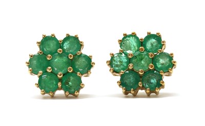 Lot 1268 - A pair of 9ct gold emerald daisy cluster earrings