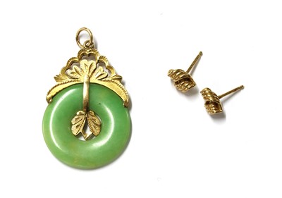 Lot 1405 - A gold jade pendant