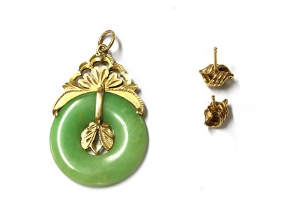 Lot 1405 - A gold jade pendant