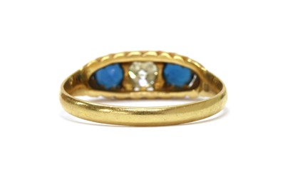 Lot 1027 - An Edwardian gold diamond and sapphire three stone ring