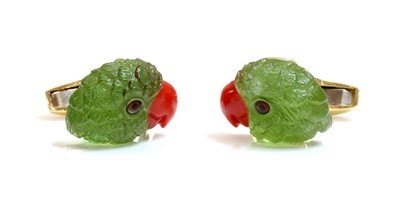 Lot 338 - A pair of 18ct gold carved peridot and coral parrot head cufflinks, by Deakin & Francis, retailed by Hamilton & Inches, c.2010
