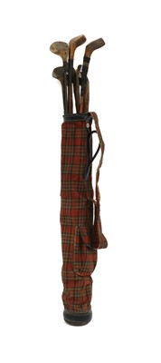 Lot 226 - A bag of old wooden shafted golf clubs
