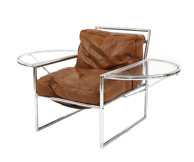 Lot 583 - A chrome and tan leather armchair